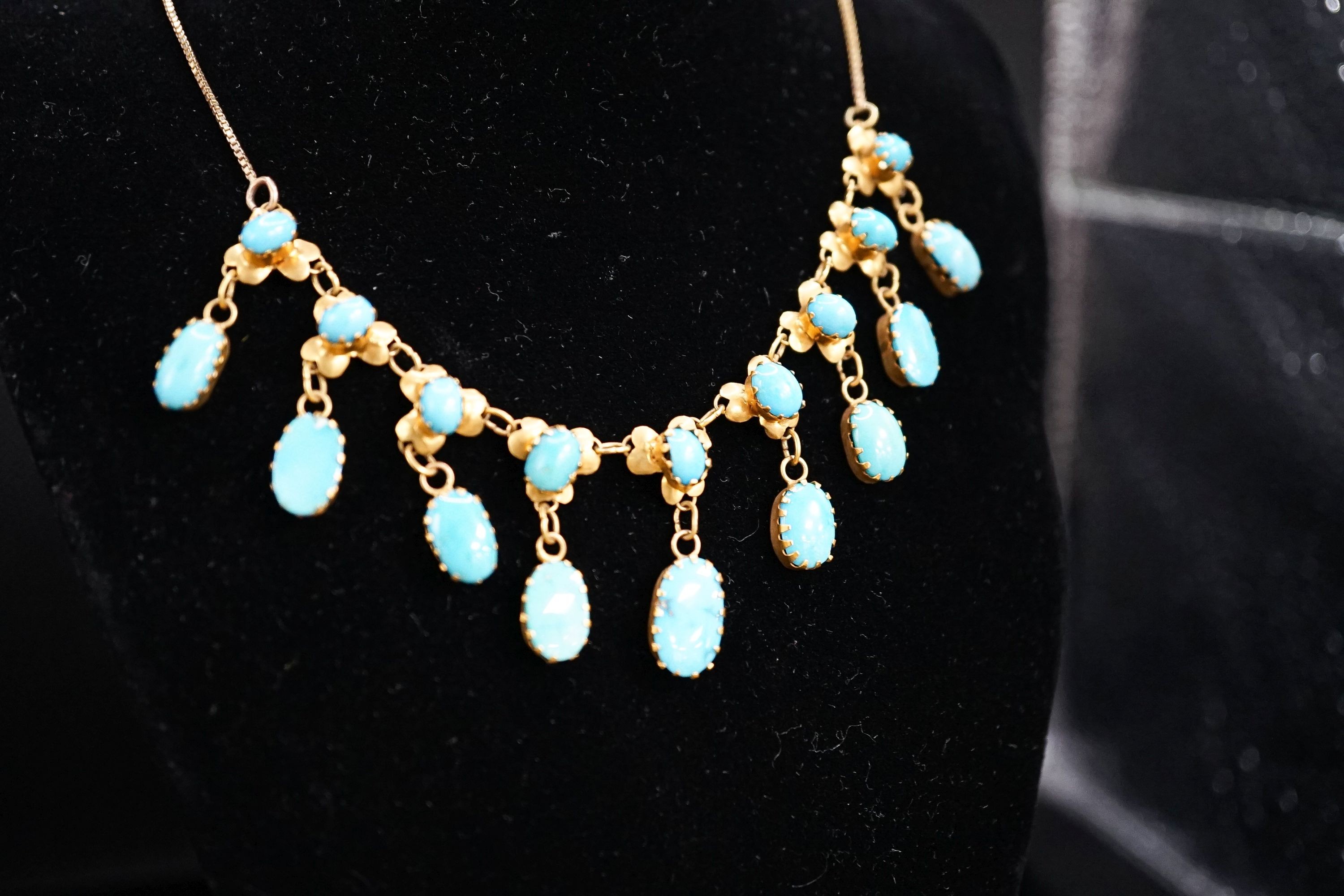 A 9k yellow metal and turquoise set drop fringe necklace, 43cm, gross 11.9 grams.